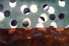 rusty-bar-in-a-box-with-holes-2-digital-photo2009